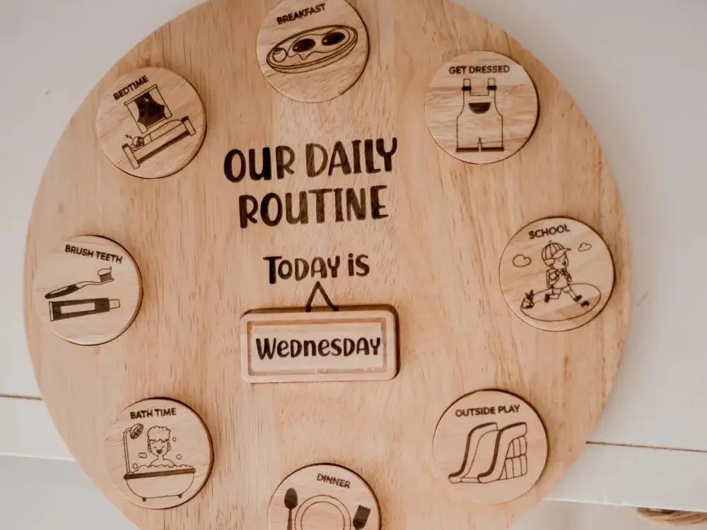 Wooden circular board displaying a daily routine schedule with icons for different activities.
