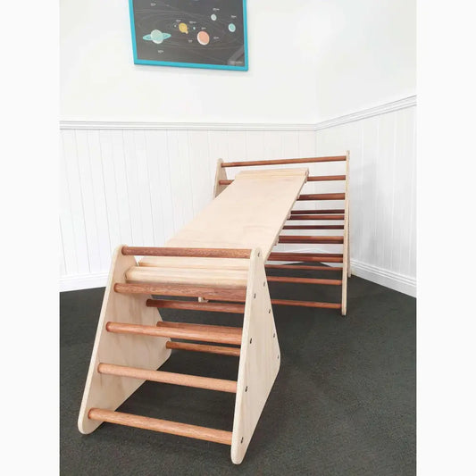 Wooden climbing structure with steps and bars for children’s play and development.