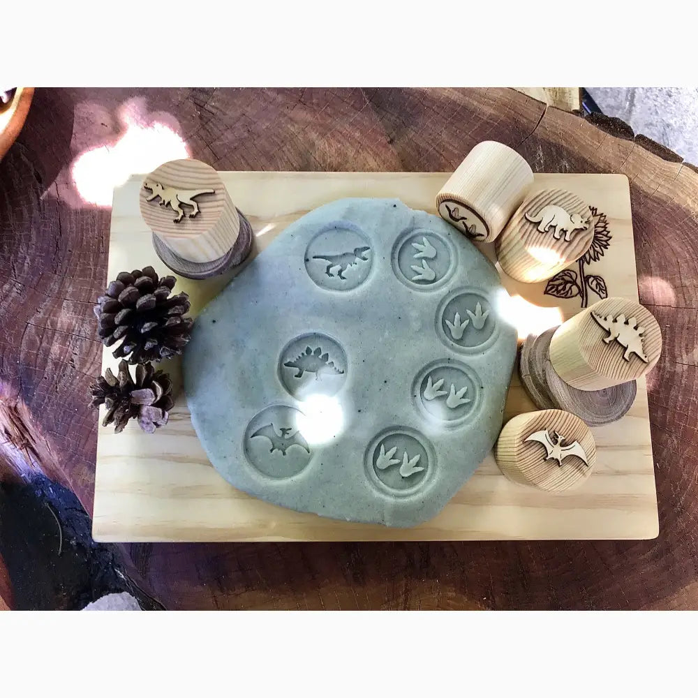 Clay or dough disc with various stamped impressions of celestial symbols.