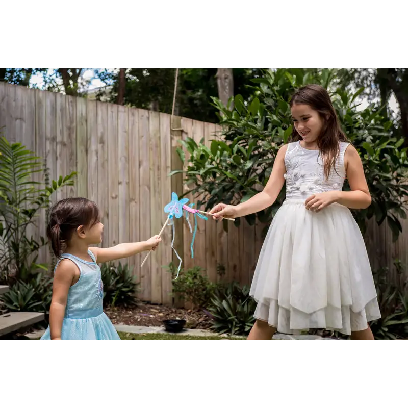 Two girls playing with a wand.