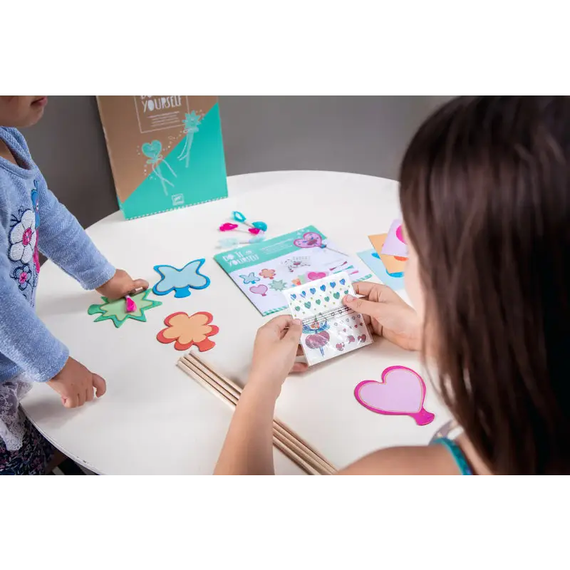 Crafting activity with stickers and shapes.