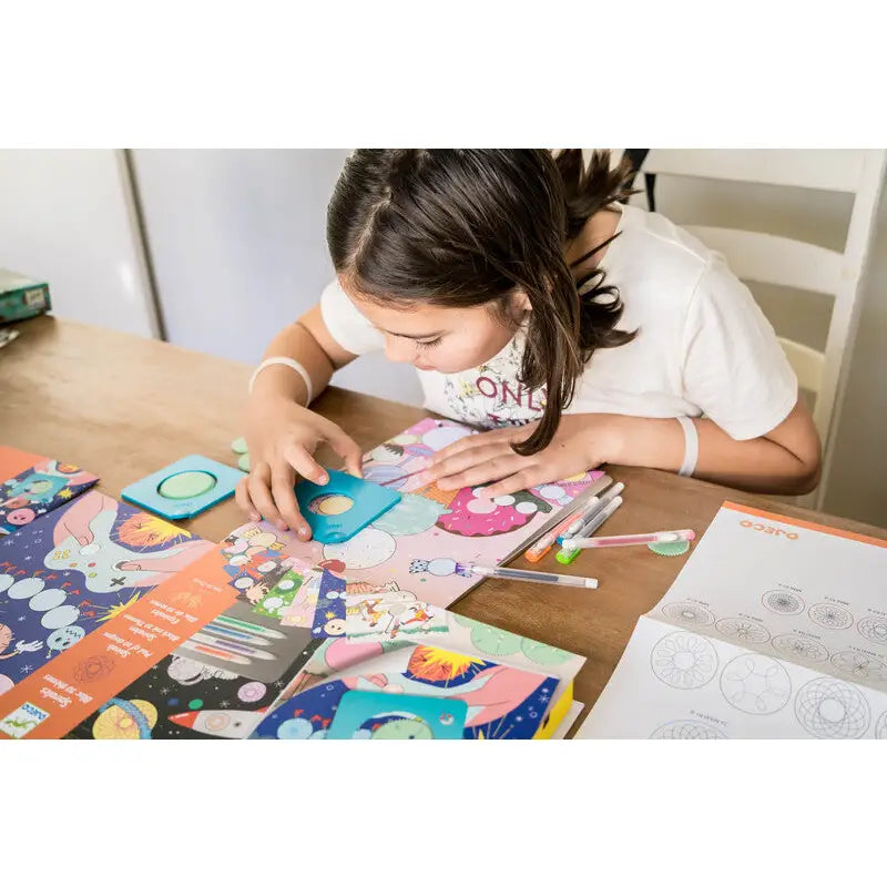 Child engaged in a colorful arts and crafts project at a table.