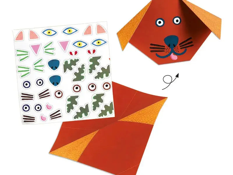 Origami-style dog face made from folded orange and red paper with drawn-on features.