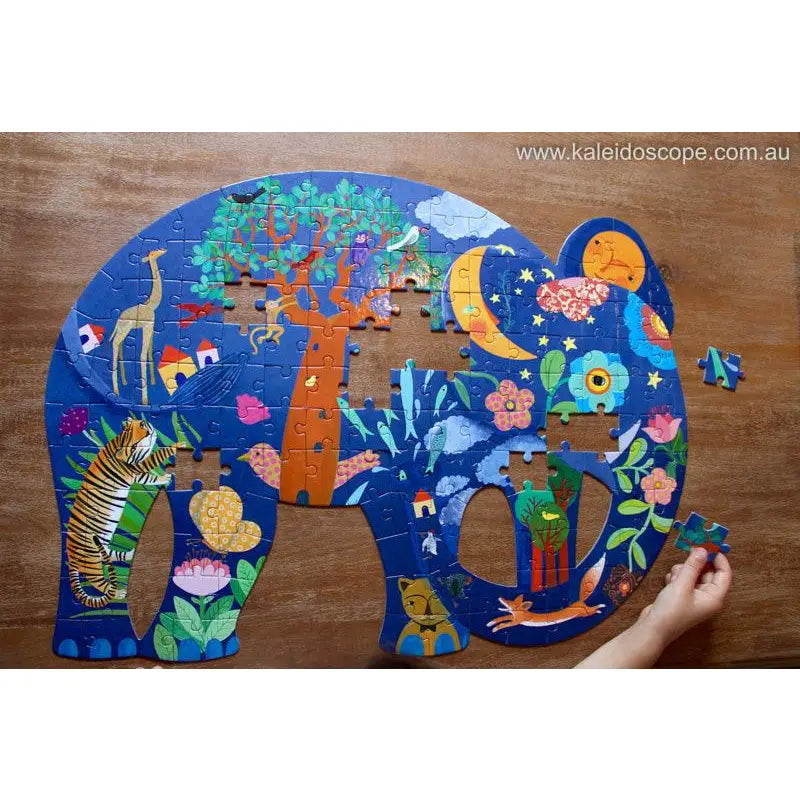 Colorful elephant-shaped jigsaw puzzle filled with whimsical nature and animal designs.