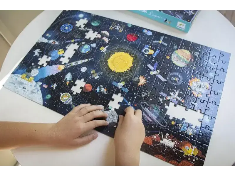 Partially completed jigsaw puzzle depicting a colorful space scene with planets and stars.
