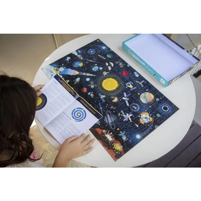 Space-themed notebook or journal with colorful celestial illustrations on its cover.