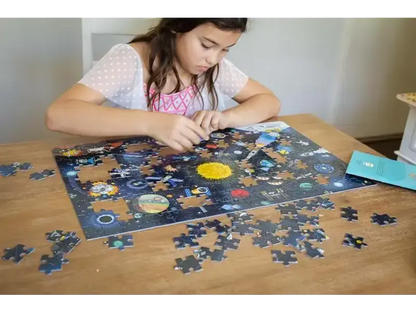 Puzzle depicting the solar system with planets and space objects.