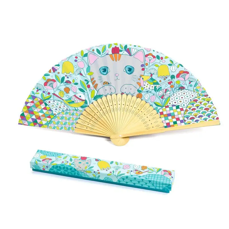 Colorful folding hand fan with a cat face and whimsical patterns, accompanied by a matching case.