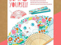 Colorful folding fan with a cat face and floral design to be colored in.
