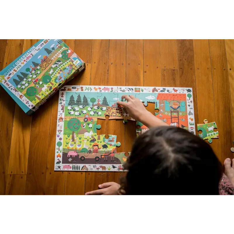 Colorful children’s puzzle being assembled on a wooden floor.