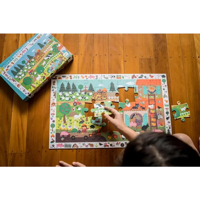 Colorful children’s jigsaw puzzle being assembled on a wooden floor.