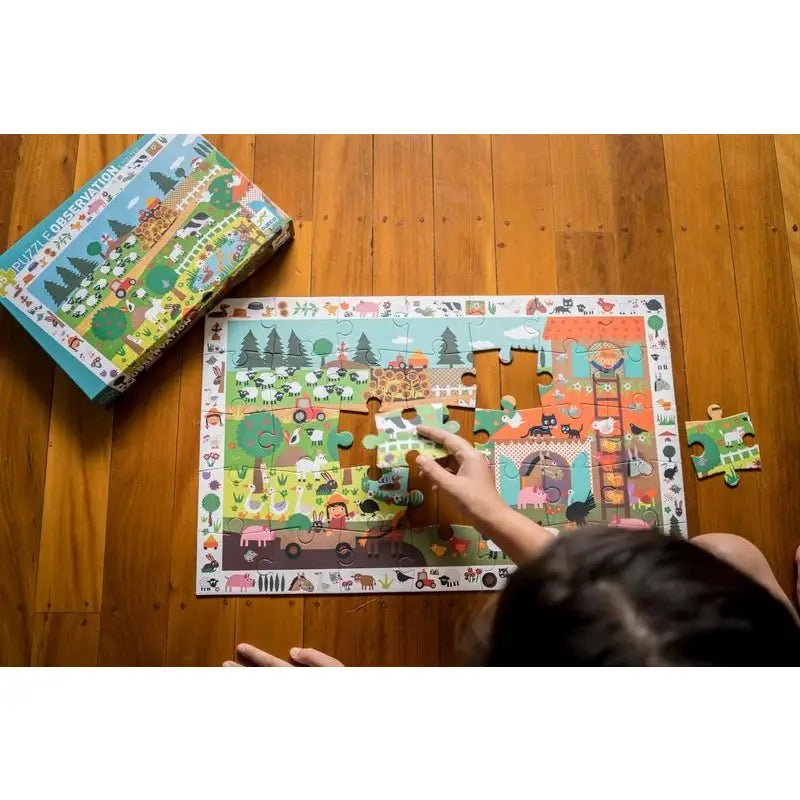 Colorful children’s jigsaw puzzle being assembled on a wooden floor.