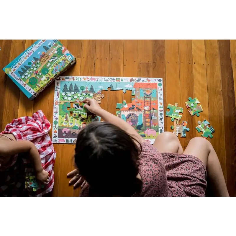 Colorful children’s puzzle being assembled on a wooden floor.