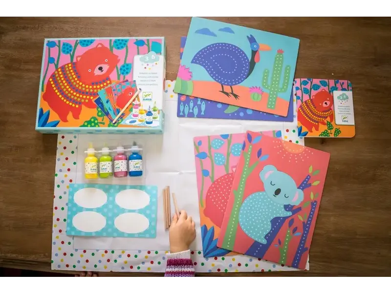Colorful children’s art kit featuring animal-themed puzzles, paint bottles, and craft supplies.