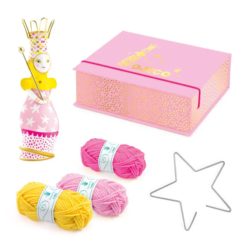 Pink gift box with gold polka dot pattern and ’Knit’ text on top.