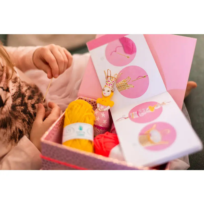 Gift box containing Easter-themed items like a chocolate bunny and colorful eggs.