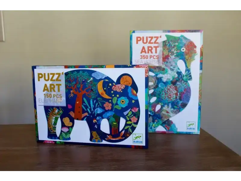 Two colorful puzzle boxes featuring whimsical animal designs.
