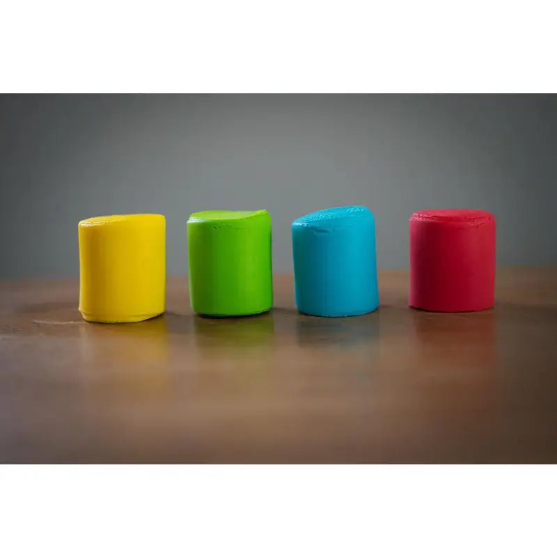 Four colorful cylindrical objects arranged in a row.