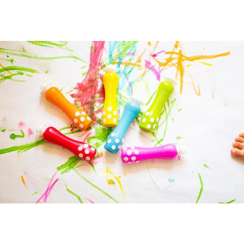 Colorful party horns or noisemakers with polka dot patterns.