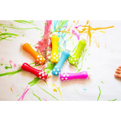 Colorful party horns or noisemakers with polka dot patterns.