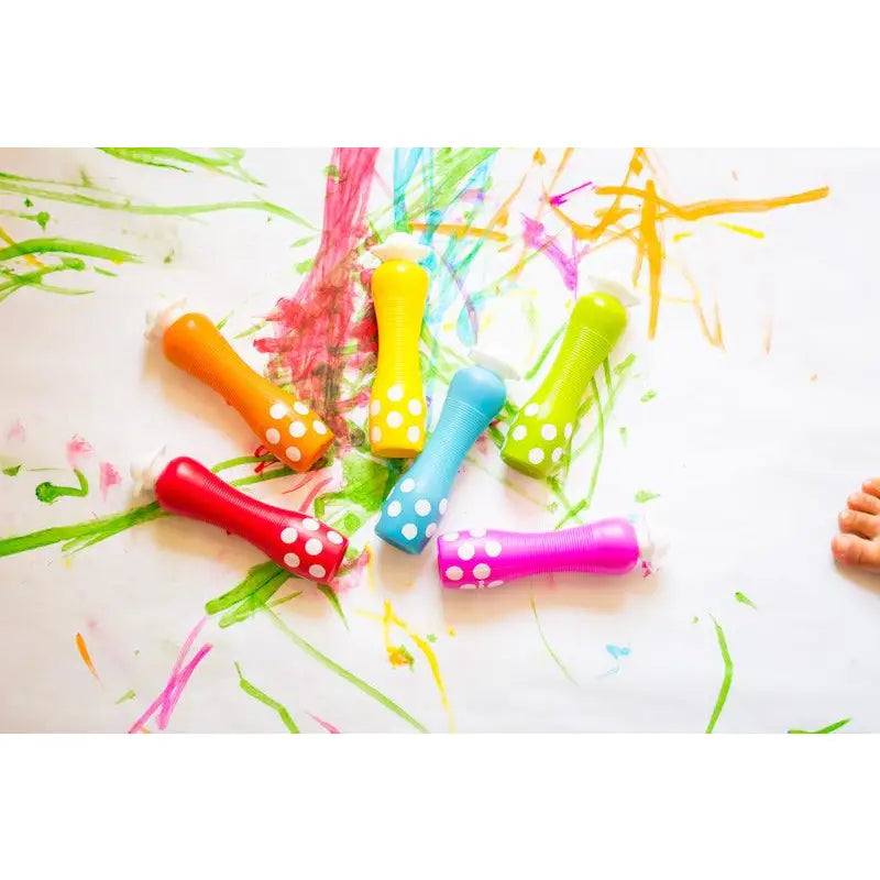 Colorful party horns or noisemakers with polka dot patterns.