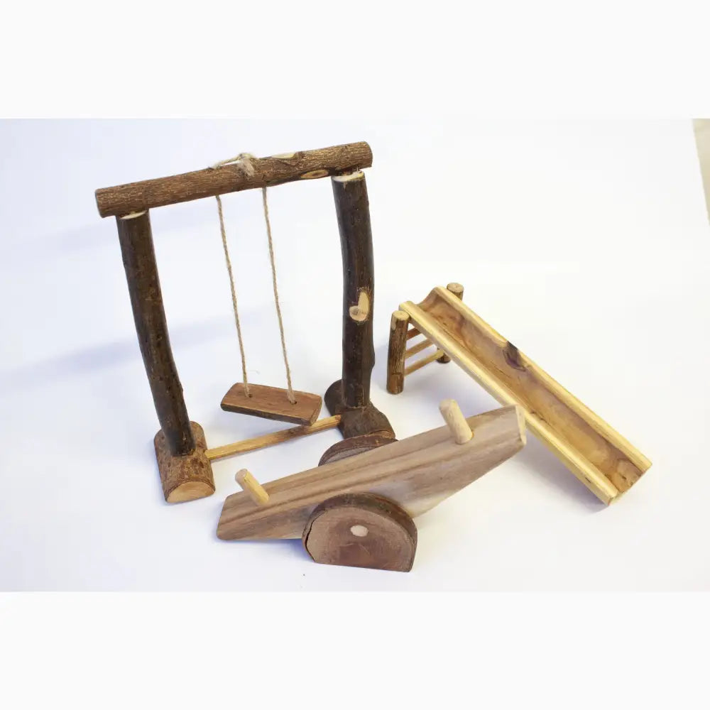 Wooden swing set with accompanying playground equipment pieces.