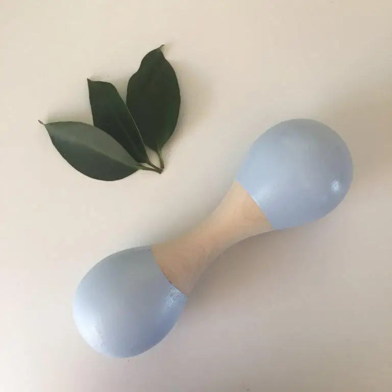 Light blue dumbbell with wooden center grip.