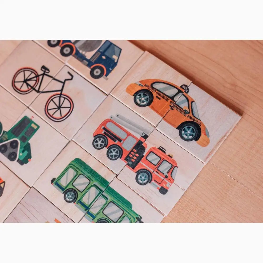 Set of wooden blocks or tiles with colorful vehicle illustrations.