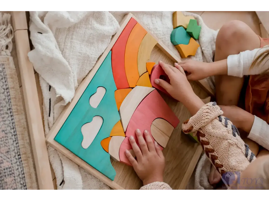 Colorful wooden rainbow puzzle toy with cloud shapes.