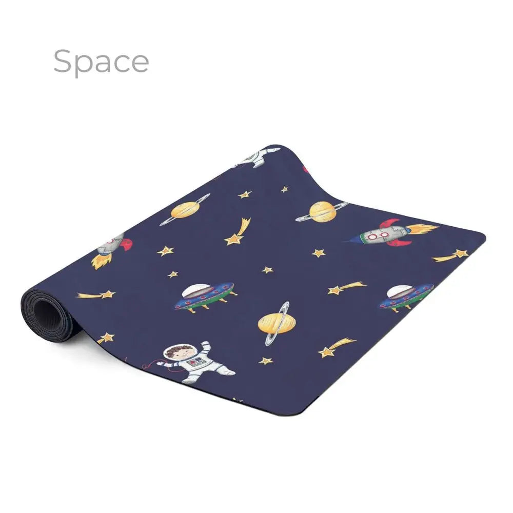 Space-themed yoga or exercise mat with colorful cartoon space motifs on a dark blue background.