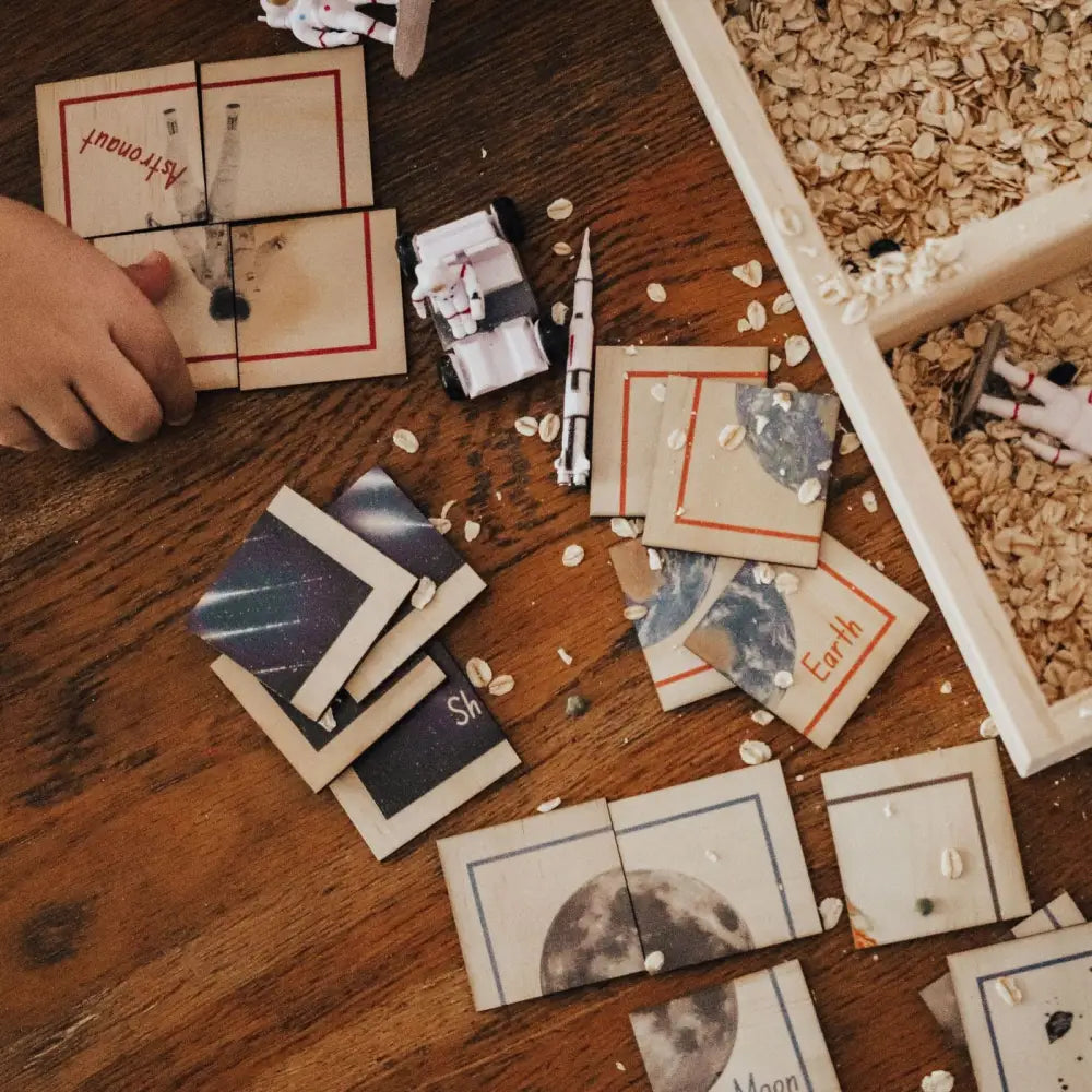 Collection of scattered Polaroid-style photographs on a wooden surface.