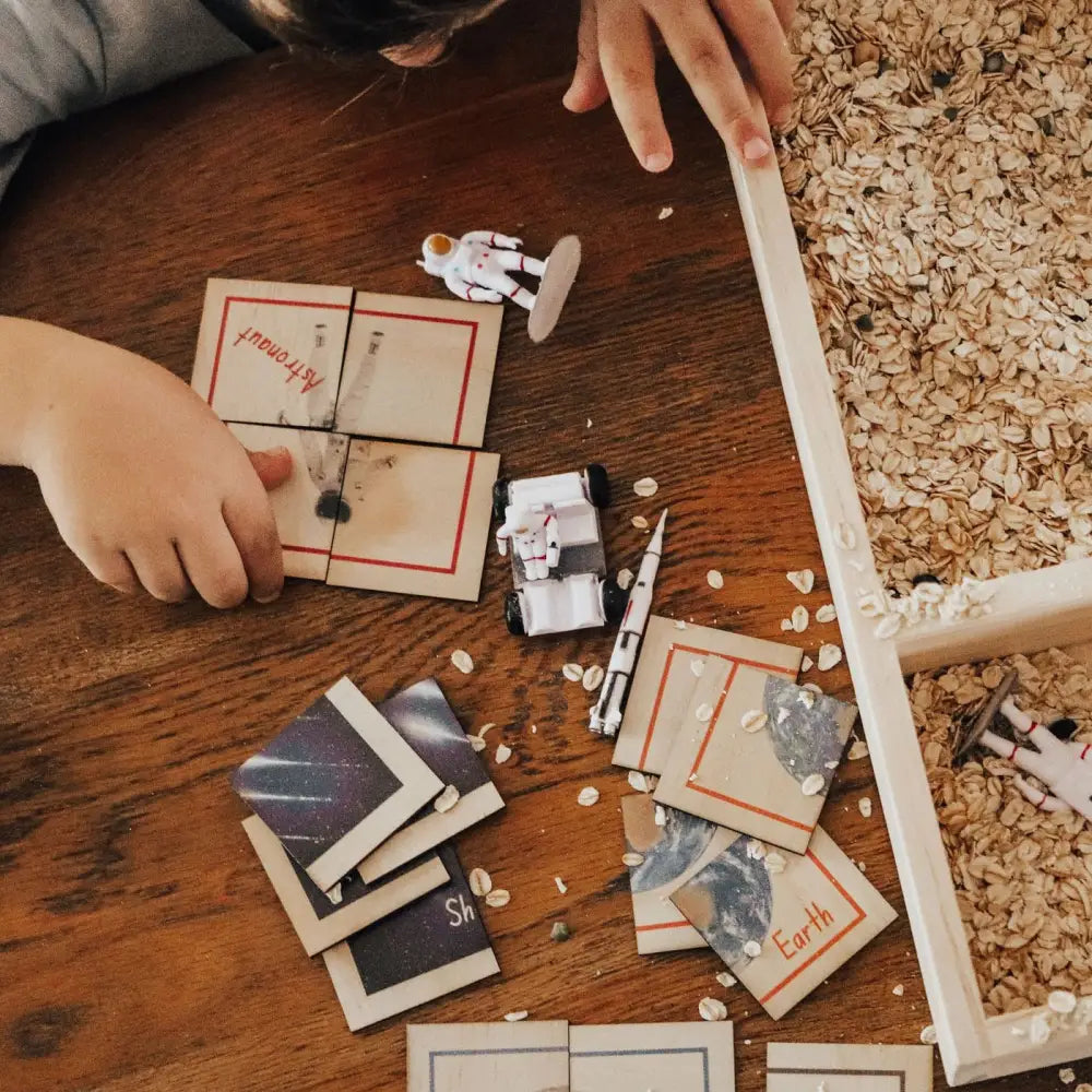 Disassembled IKEA furniture pieces and instructions scattered on a wooden surface.