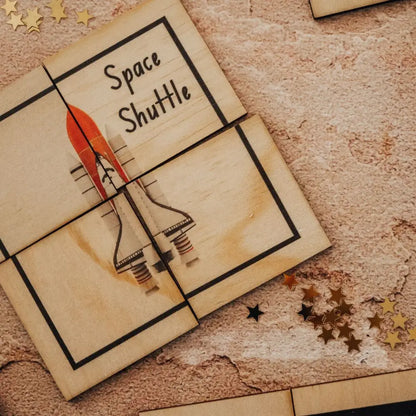 Wooden puzzle piece depicting a space shuttle with ’Space Shuttle’ text.