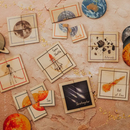 Collection of astronomy-themed cards or tiles depicting various celestial bodies and space phenomena.