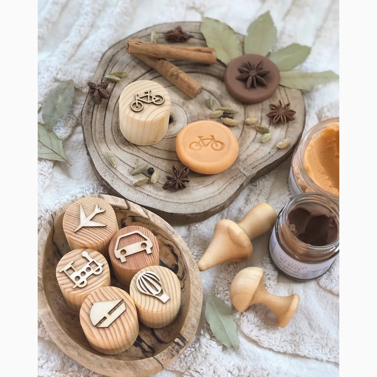 Collection of wooden stamps with various transportation-related icons.