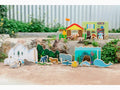 Colorful wooden toy set featuring various animals and habitats, including an igloo, forest, and underwater scenes.