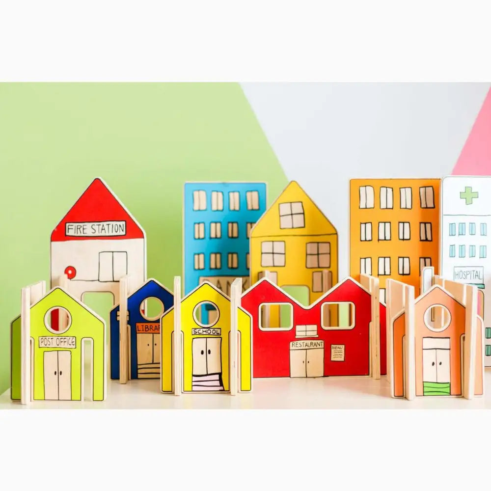 Colorful wooden toy buildings representing a miniature town or cityscape.