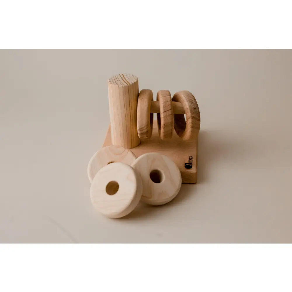 Wooden napkin holder with circular napkin rings.