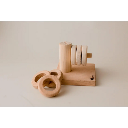 Wooden toy or puzzle with circular rings and a vertical post.