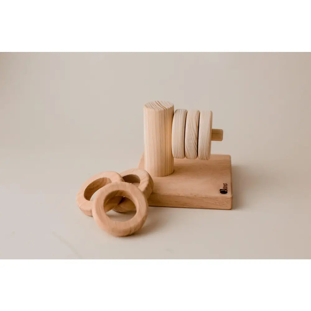 Wooden toy or puzzle with circular rings and a vertical post.