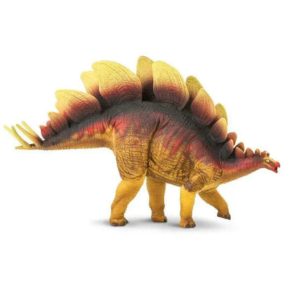 Colorful plastic toy model of a Stegosaurus dinosaur.