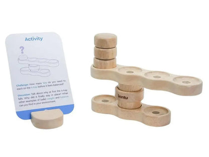 Wooden balancing toy with stackable pieces and an activity card.