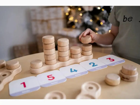 Wooden counting toy with numbered clouds and stacking discs.
