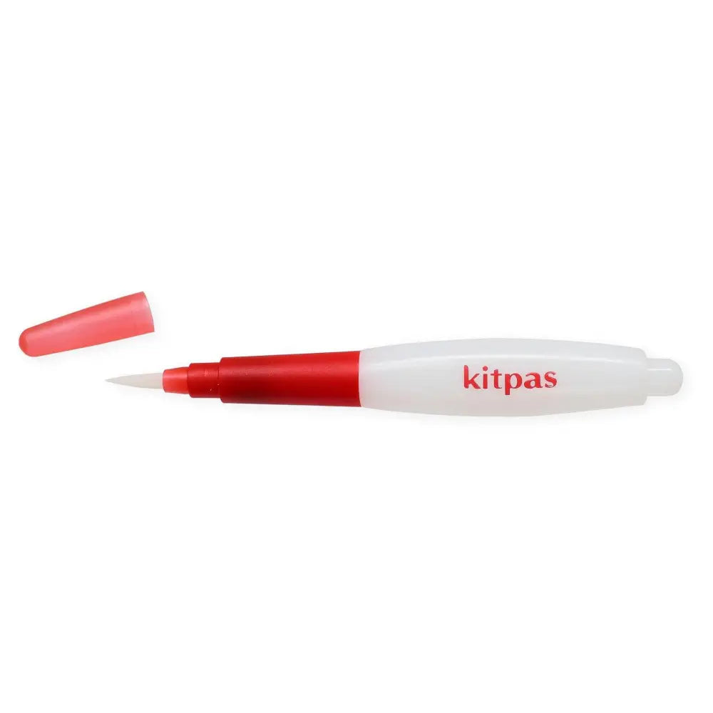 Red and white marker pen labeled ’kitpas’ with its cap removed.