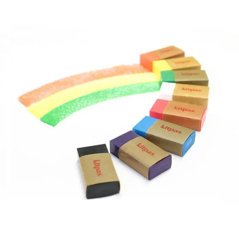 Rainbow-shaped arrangement of colorful erasers.