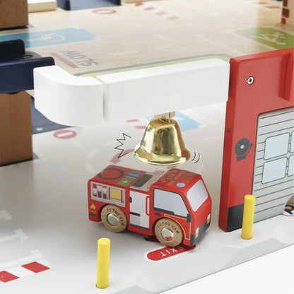 Toy fire truck under a bell.