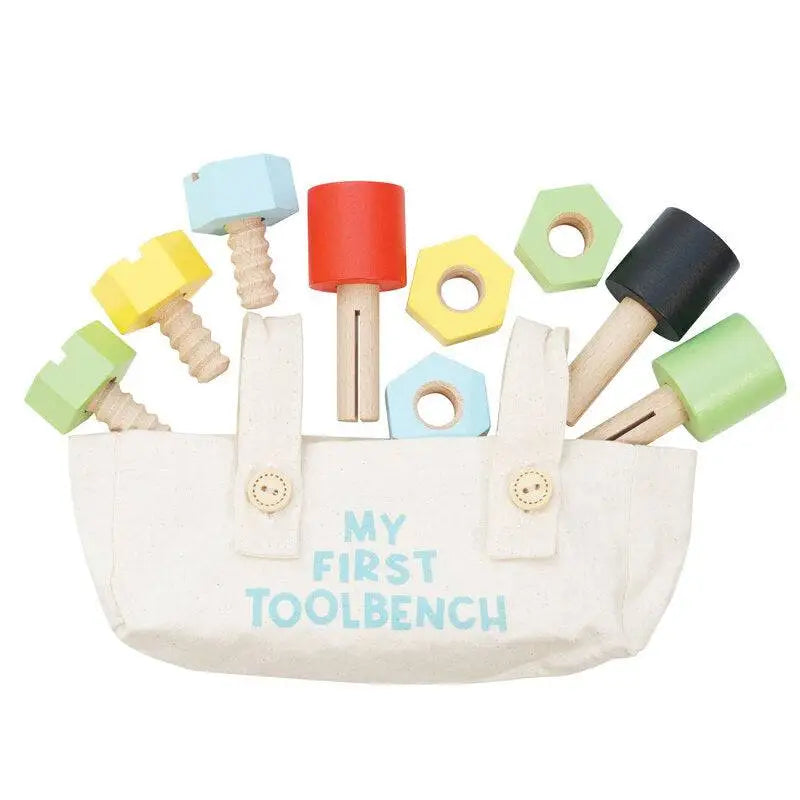 Colorful wooden toy tool set in a canvas bag.