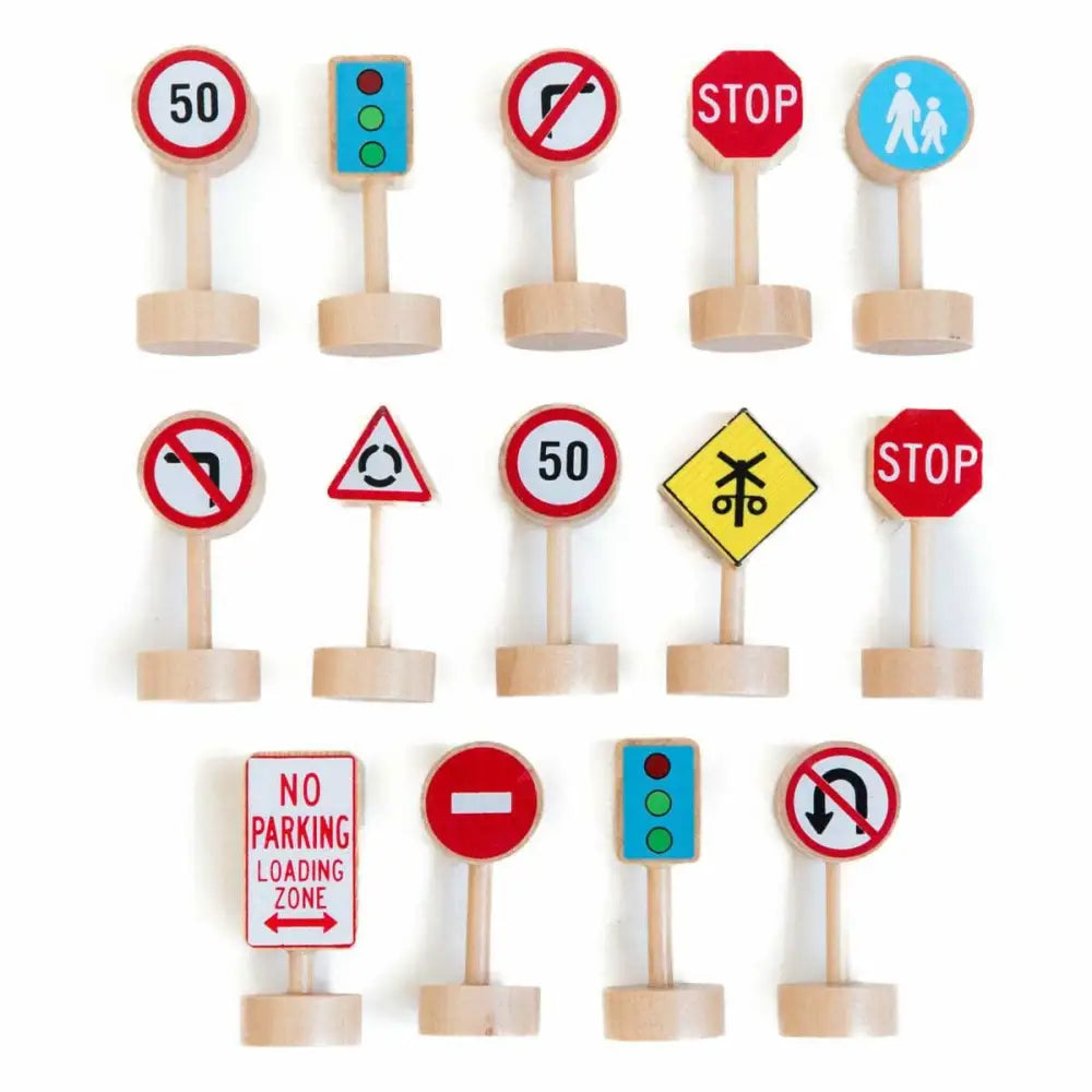 Collection of miniature wooden traffic signs and road signs.