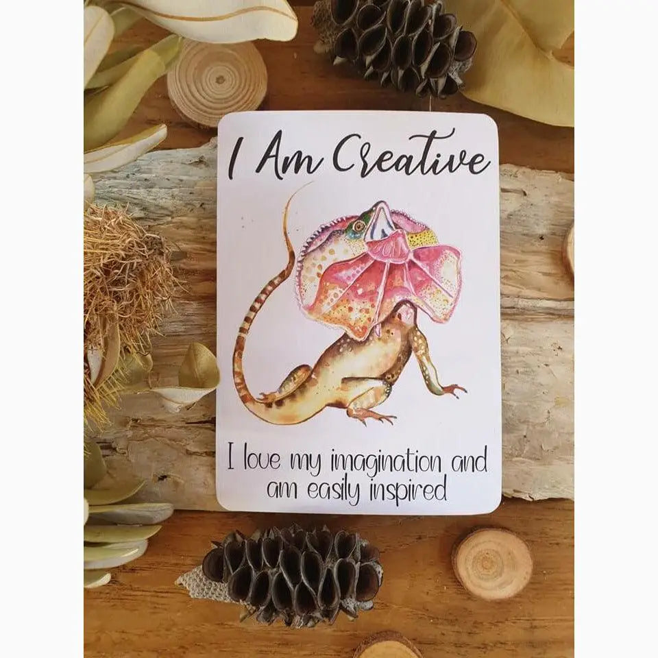 Affirmation card featuring a colorful illustration of a fantastical lizard-like creature with an umbrella-shaped head.