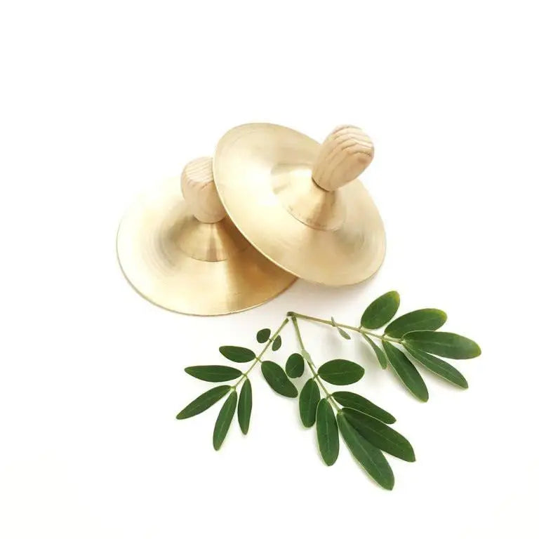 Pair of wooden finger cymbals with green olive branches.